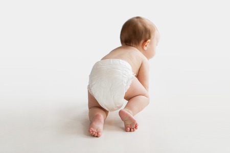 65758884-childhood-babyhood-and-people-concept-little-baby-boy-or-girl-in-diaper-crawling-on-white-floor